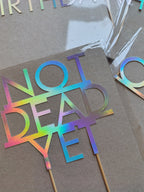 Holographic NOT DEAD YET birthday cake topper