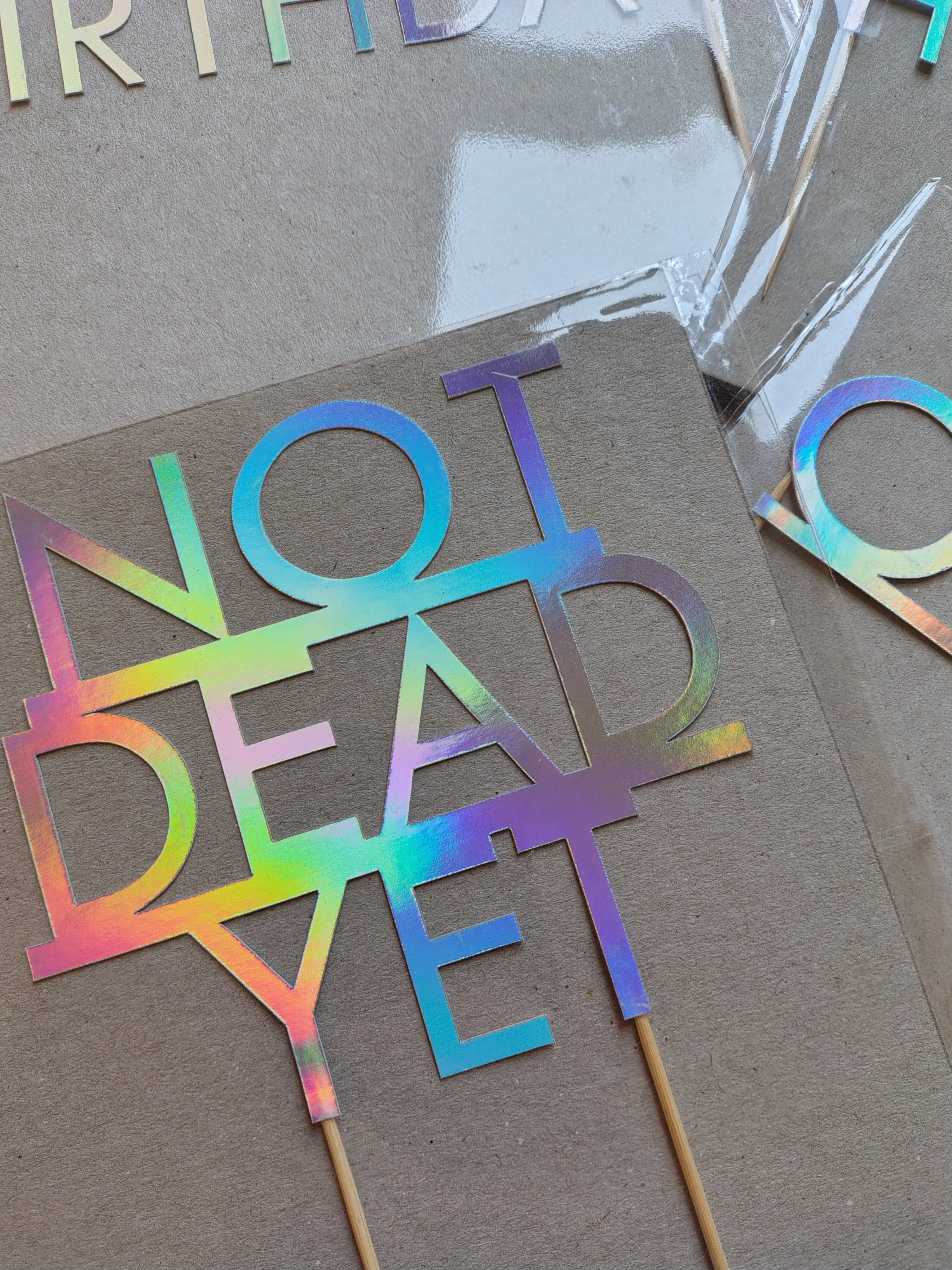 Holographic NOT DEAD YET birthday cake topper
