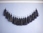 Tassel garland of navy tassels with a silver constellation design