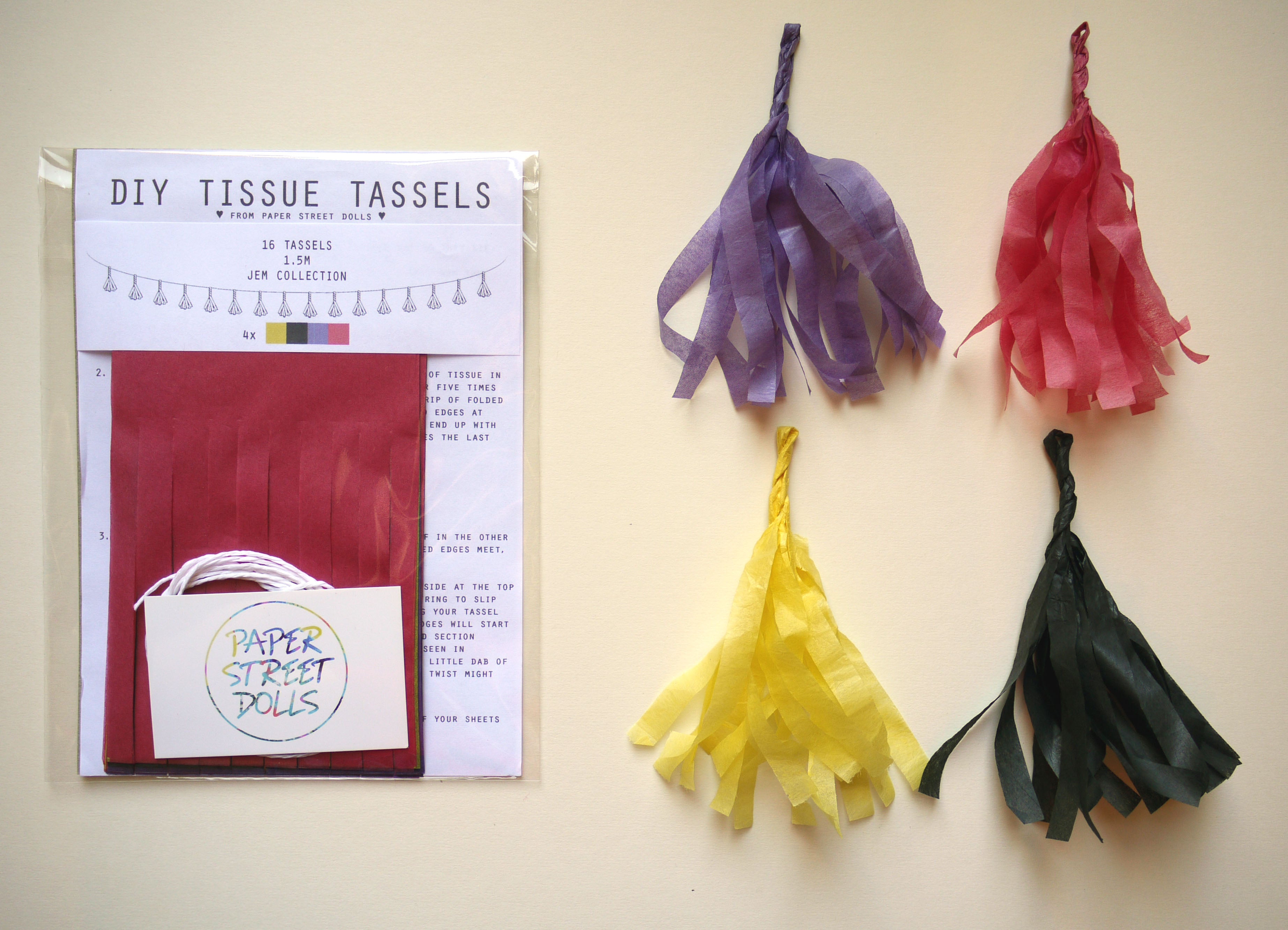 Colorful DIY tissue tassels with a paper template on a beige background
