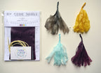 DIY tissue tassels kit with colorful tassels on a white background
