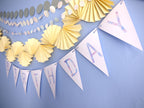 Birthday banner with colorful paper fans on a blue background
