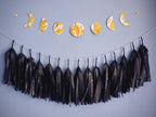 Flower Moon phases wall hanging for summer birthday. Hand-painted with yellow, orange and gold ink this decorative yelllow paper garland creates a full moon phases wall hanging. Here its hung horizontally above navy tissue garland with a silver constellation motif