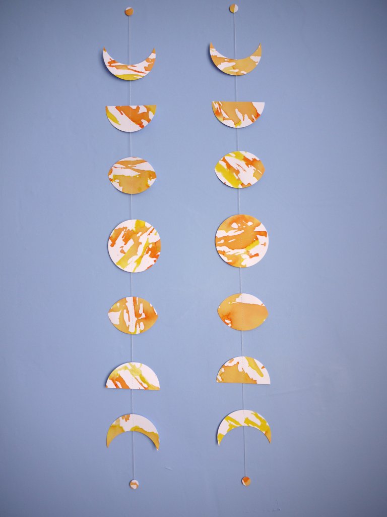 Flower Moon phases wall hangings. These decorative garlands show the unique design of these east end paper garlands. Eco friendly, hand-painted with yellow, orange and gold ink. Decorative paper garlands perfect as a May birthday gift