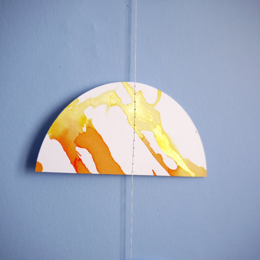 Colorful abstract design on a half-circle shape against a blue background