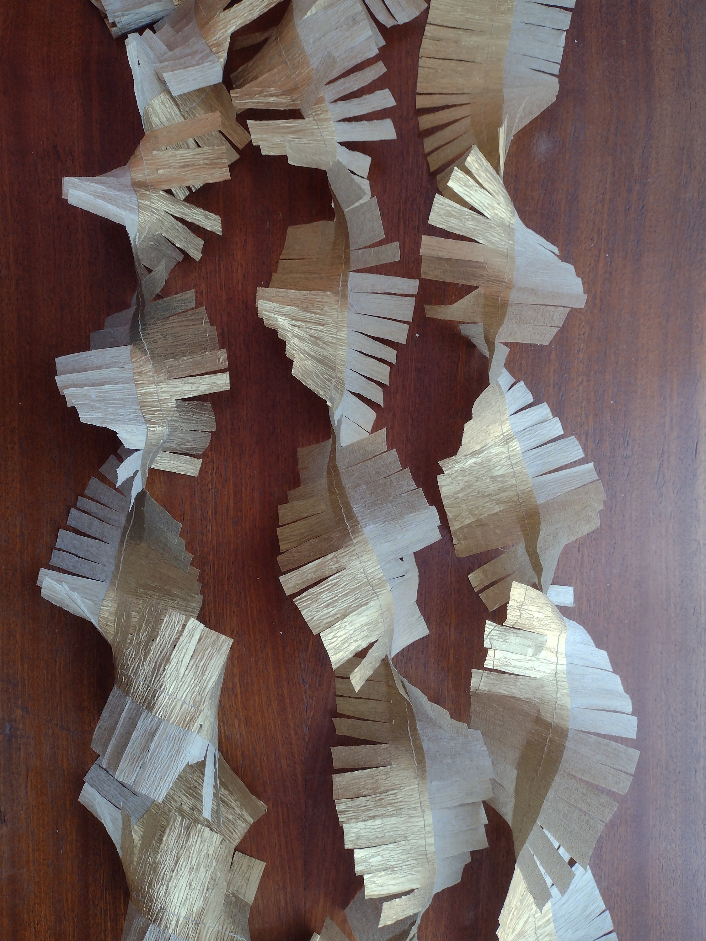 three strands of gold eco tinsel - paper fringed streamer