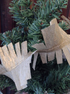 Close up on gold paper streamer draped on a Christmas tree