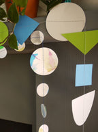 Close up on geometric and watercolour paper garlands in Paper Street Doll's OPHELIA colours of grey, grass green and blue