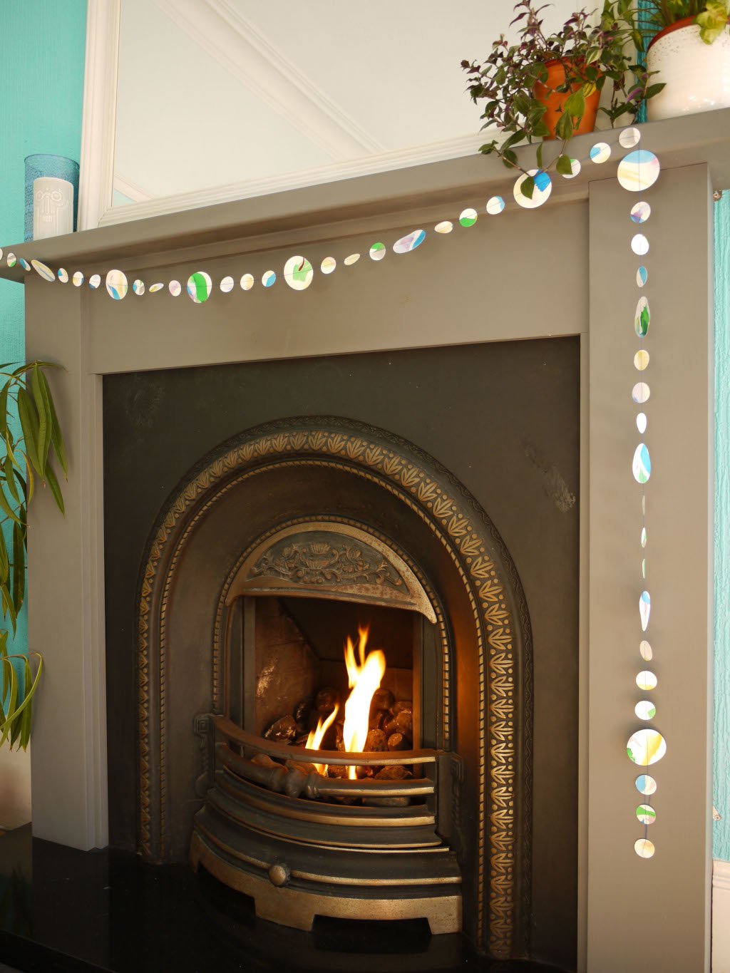 Handpainted watercolour paper garland at a fireplace