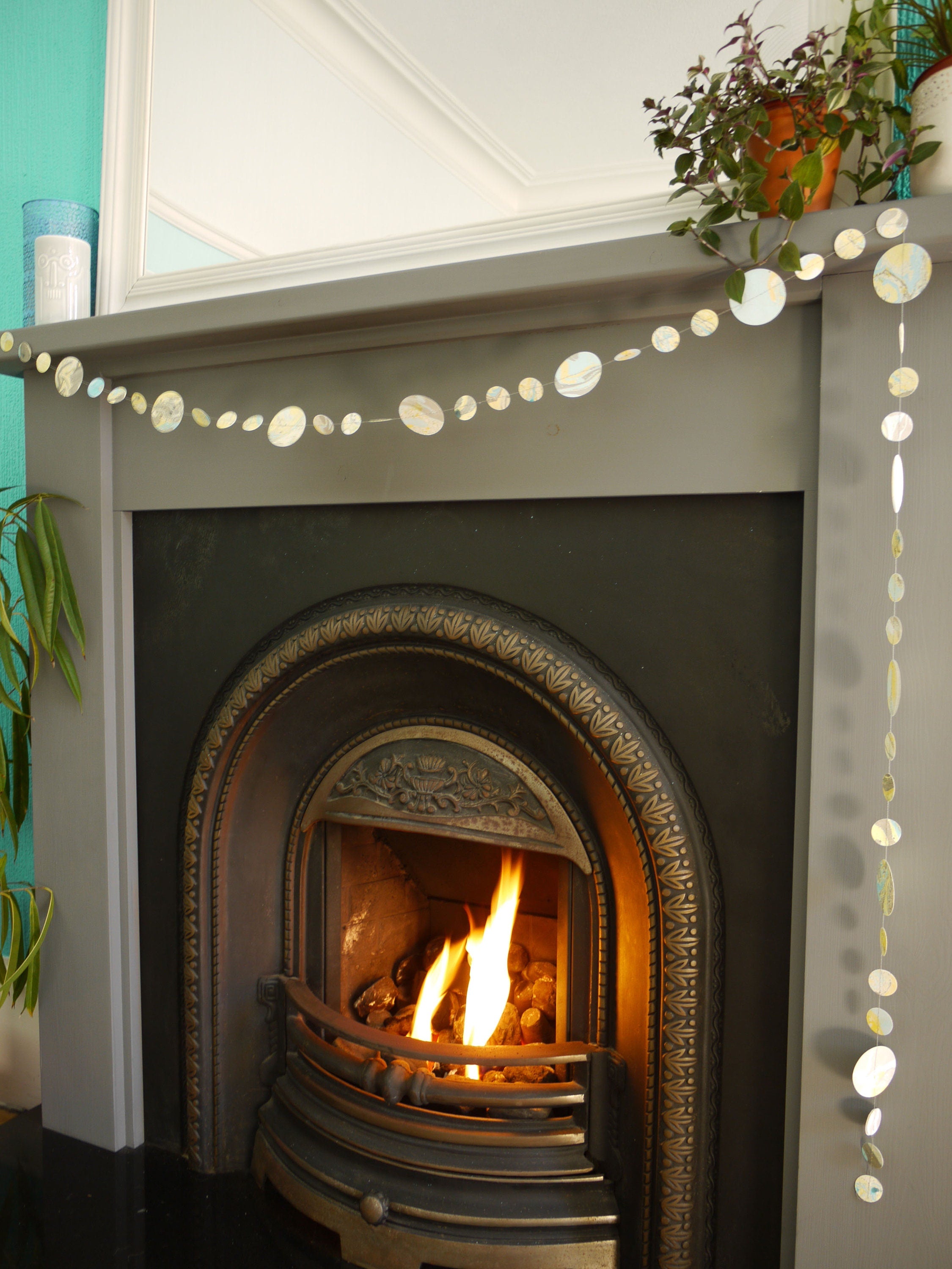 Marbled paper garland or circle shapes at a fireplace