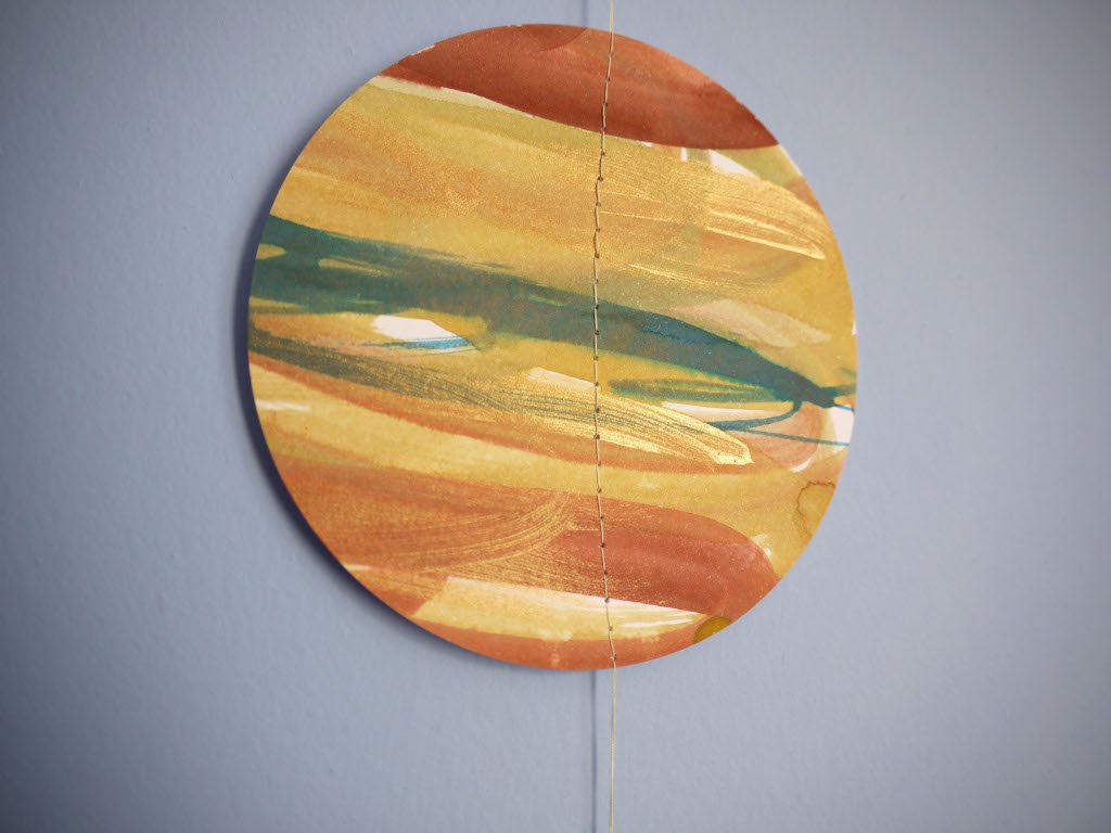 Circular abstract painting of Jupiter as part of  solar system wall hanging.