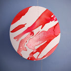 Close up on a pink and red moon phases paper garland
