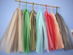 Soft coloured tassel wall hanging on a blue wall