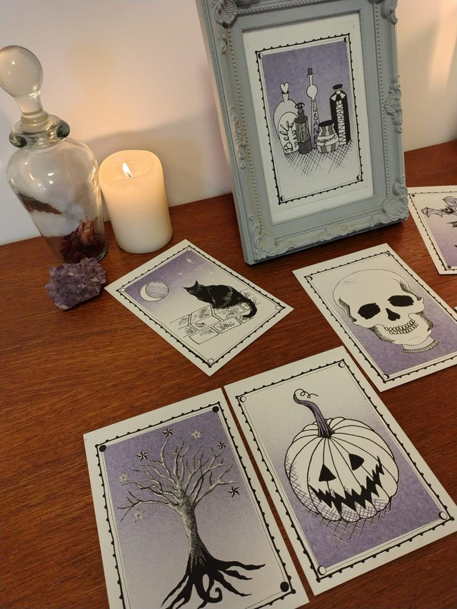 Set of halloween riso prints laid out on a wooden altar