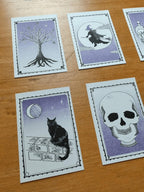 Tarot style Halloween theme riso prints with black, white and purple illustrations