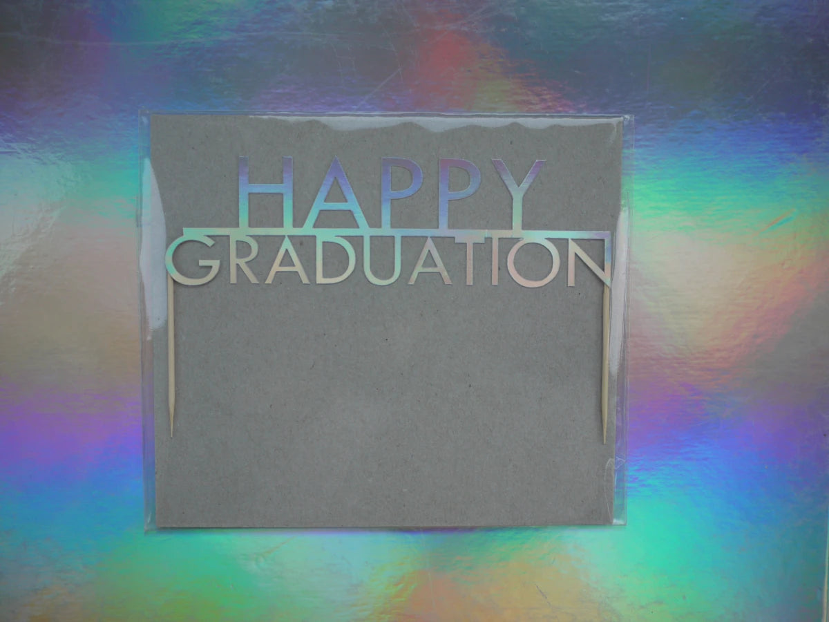 Holographic cake topper that reads 'HAPPY GRADUATION' for a graduation theme cake topper.