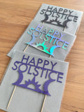 Selection of Happy Solstice cake toppers