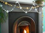 Easy New Year decorations of silver and gold sewn circle paper garlands