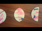 Camera pans across for Paper Street Dolls Pink Moon fiinished garland lying on a wooden table.