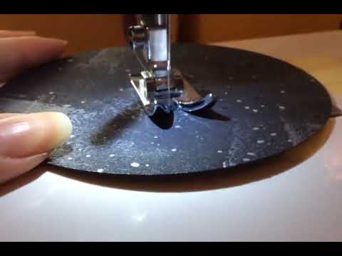 Paper Street Dolls original Black Moon wall hanging paper garland being stitched